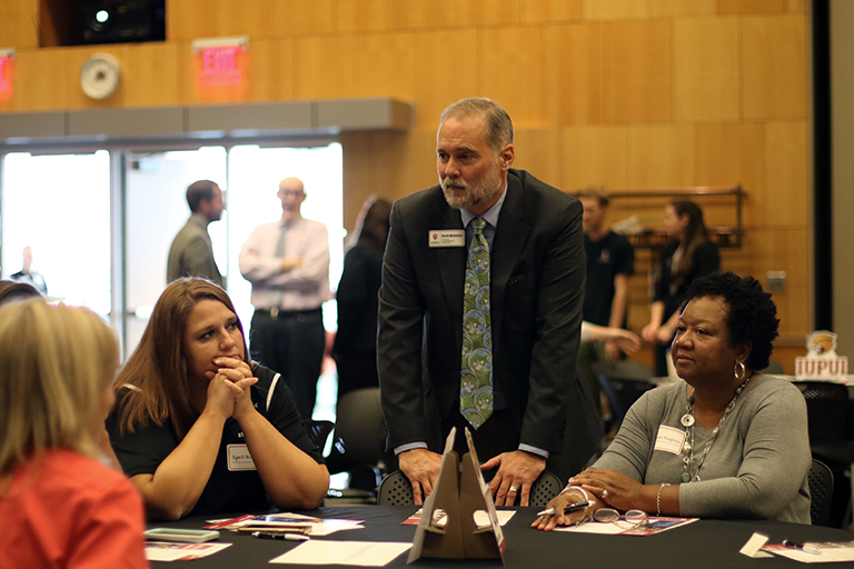 Scott McIntyre talks about IUPUI with school counselors from across Indiana in the Campus Center Ballroom